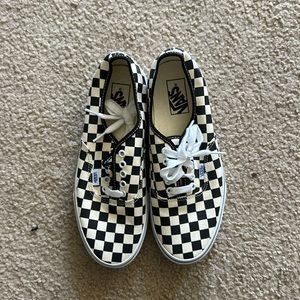 Vans authentic style shoes in black checkerboard.
